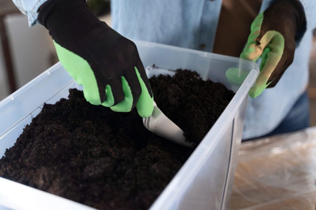gardener preparing soil for planting