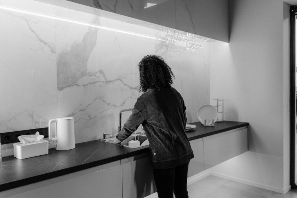 Househelp in Nairobi cleaning a modern home