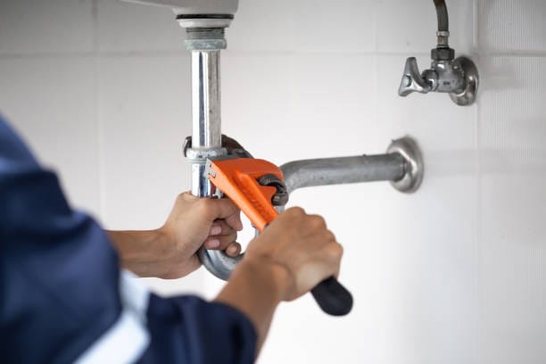 Professional plumber fixing a leaking pipe in Nairobi, Kenya – expert plumbing services