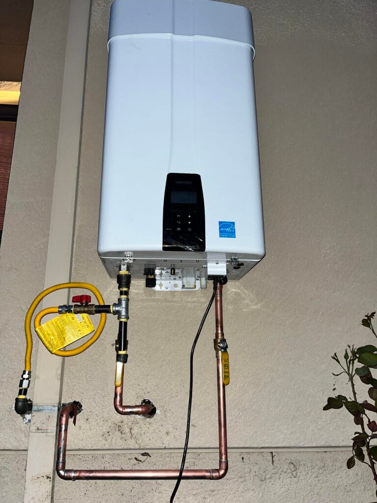 Tankless hot water plumber installing system in Kiambu
