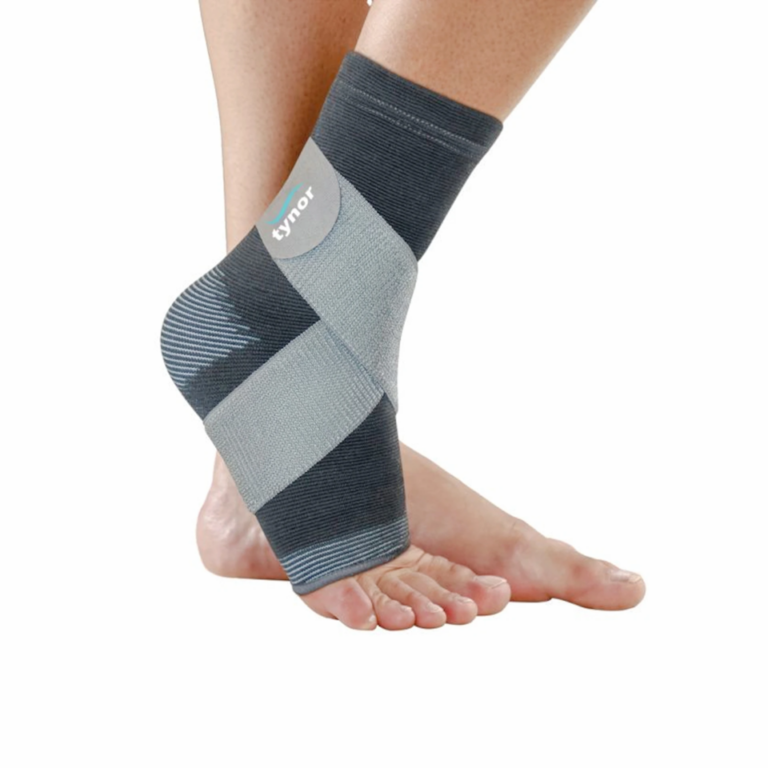 Close‑up of foot wearing gray and black Tynor elastic ankle support brace with crisscross compression design Nairobi Kenya.