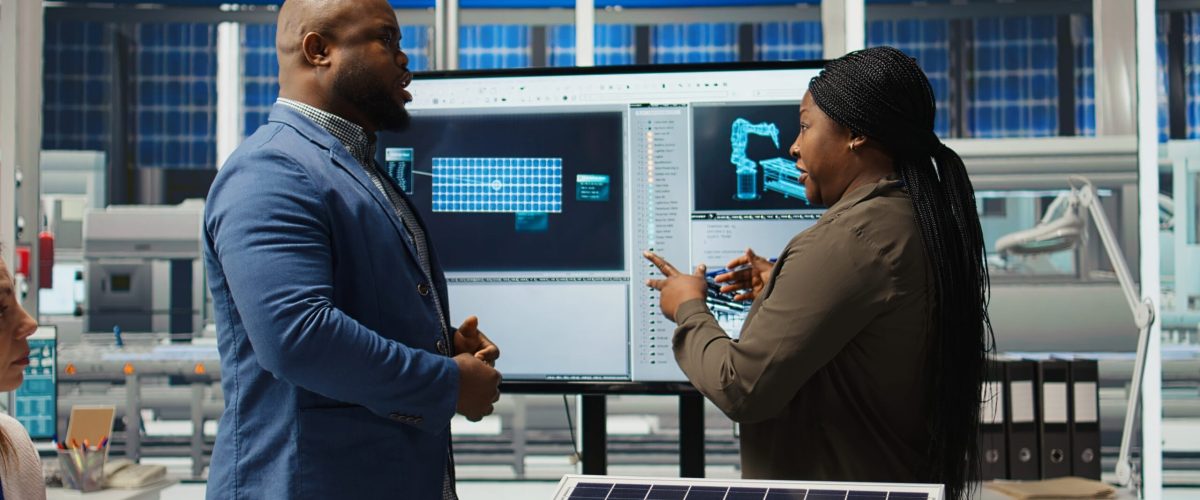 solar technicians demonstrating panels to rural community Kenya
